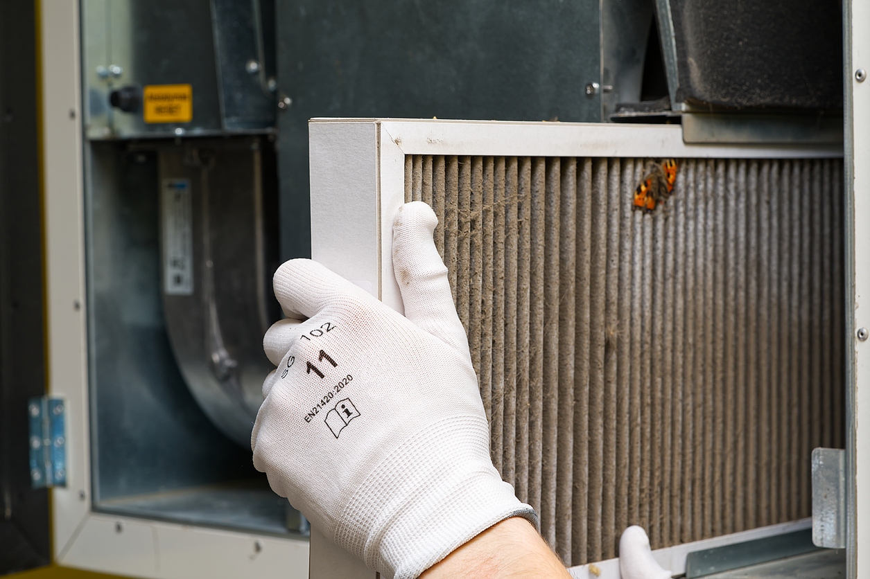 Replacing filter in the central ventilation system. hvac filter replacing home central air system Replacing filter in the central ventilation system. hvac filter replacing home central air system