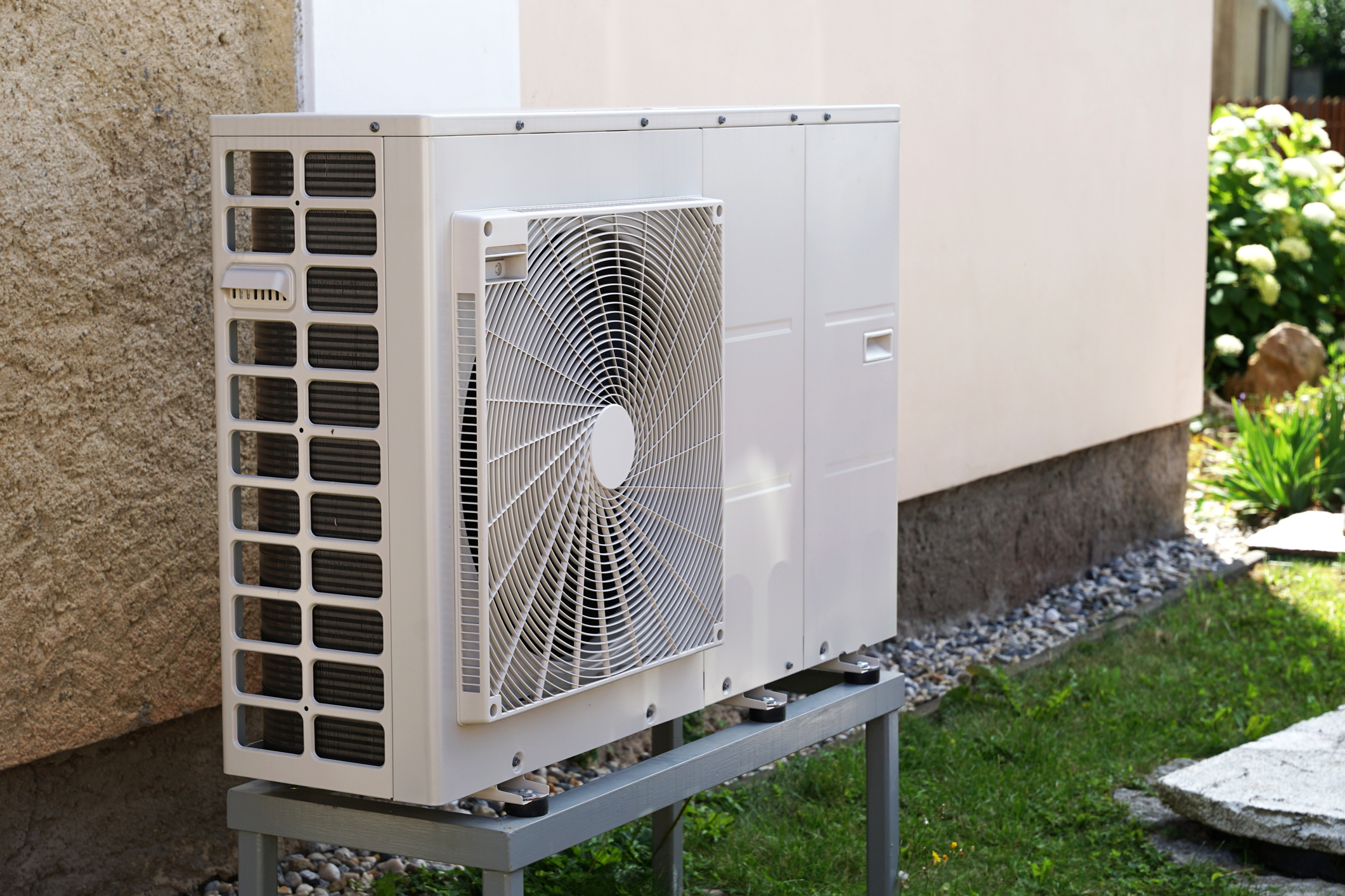 Heat pump or air conditioning outdoor unit in modern house of future using green electric energy, heat pump – efficient source of heat Heat pump or air conditioning outdoor unit in modern house of future using green electric energy, heat pump – efficient source of heat