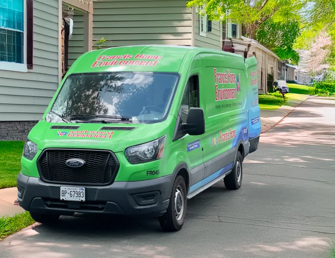 francis-truck Francis service van with HVAC, plumbing, and electrical branding parked in a suburban neighborhood, promoting local trust.