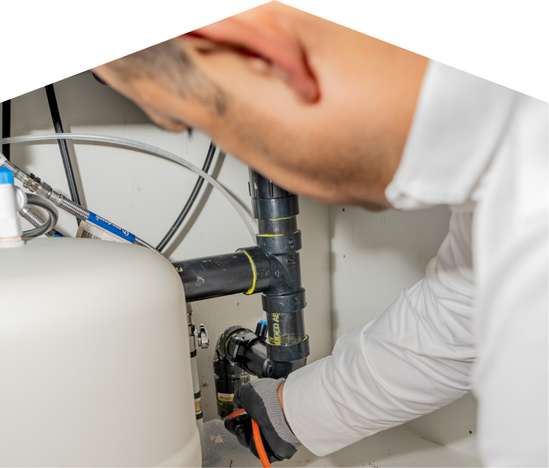 Francis Home plumbing specialist using a hydro jet to clear a clogged drain. Francis Home plumbing specialist using a hydro jet to clear a clogged drain.
