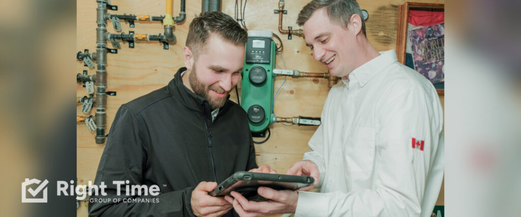 HVAC technician reviewing furnace, humidifier, and indoor air quality settings with a homeowner on a tablet during an Ottawa home visit.